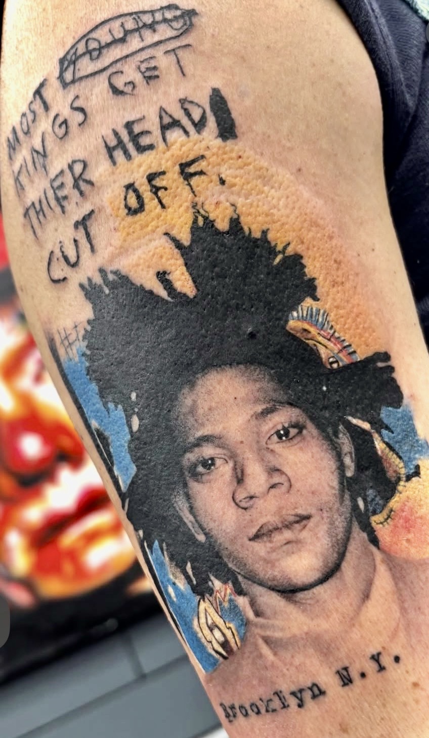 Discover the meaning behind Jean-Michel Basquiat tattoos and learn how Red Baron Ink Tattoo & Piercing in NYC transforms iconic fine art into custom tattoos designed to last.
